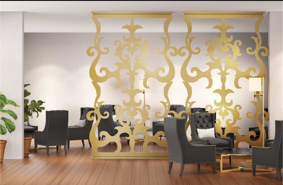 Gold laser-cut lobby screens dividing a hospitality lounge
